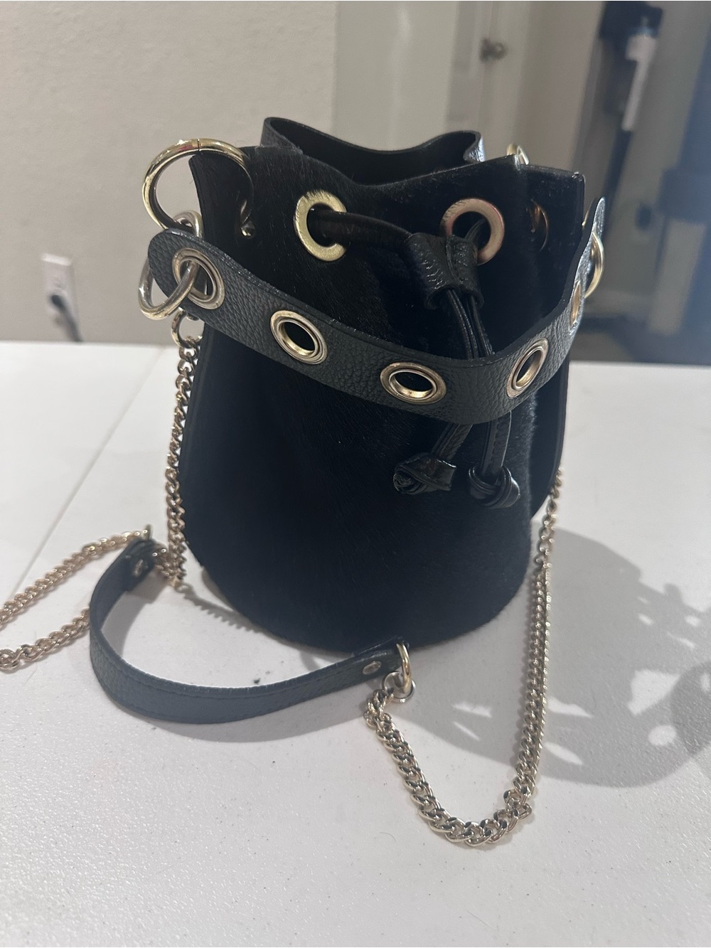 ITALIAN LEATHER & COWHIDE BUCKET BAG, BLACK